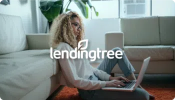 Lending Tree logo over image of a woman sitting behind a computer