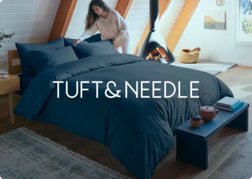 Tuft and Needle logo over an image of a woman making her bed