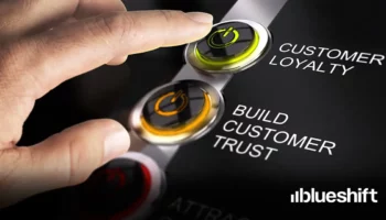 A hand hovering over buttons labeled "customer loyalty" and "build customer trust"