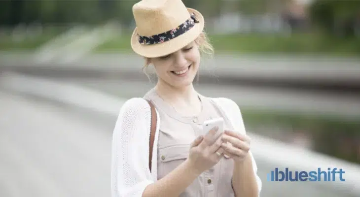 Woman smiling looking at phone